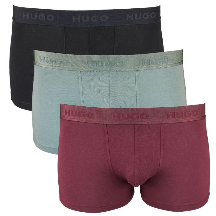 Three pairs of Hugo boxer briefs in black, green, and red on a white background.
