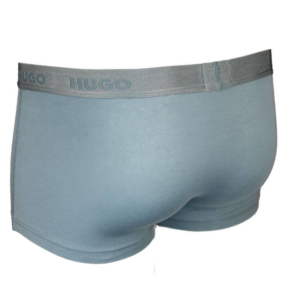 Green men's underwear with 'Hugo' brand label on a white background