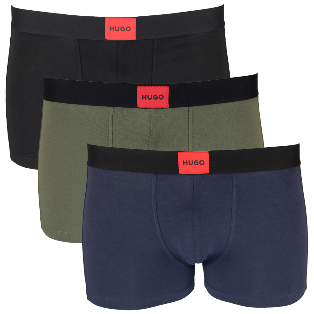 Three pairs of men's boxer trunks in black, green, and navy with 'HUGO' branding on a white background.