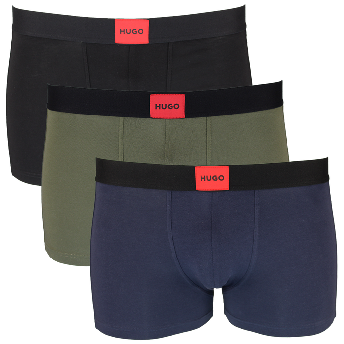 Three pairs of men's boxer trunks in black, green, and navy with 'HUGO' branding on a white background.