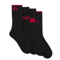 Set of black socks with red branding on a white background