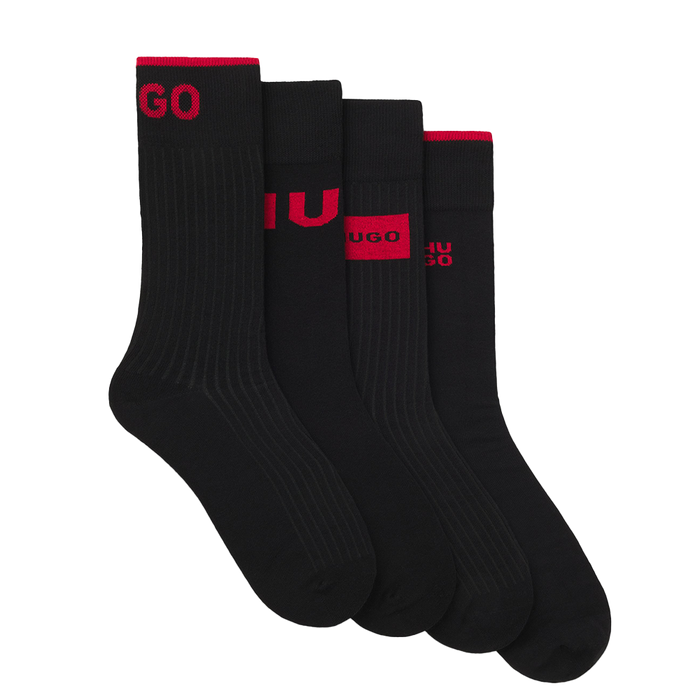 Set of black socks with red branding on a white background