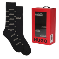 Black socks with brand logo and a red box packaging on a white background