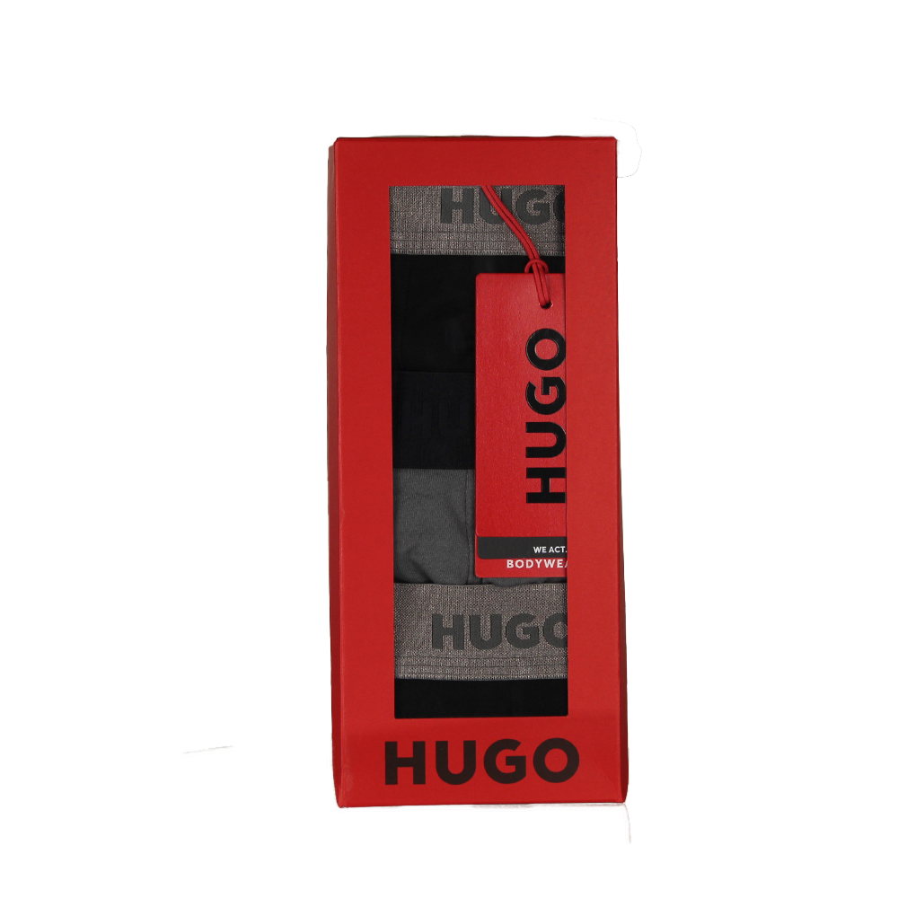 Red HUGO boxers packaging with gray boxer briefs inside on a white background