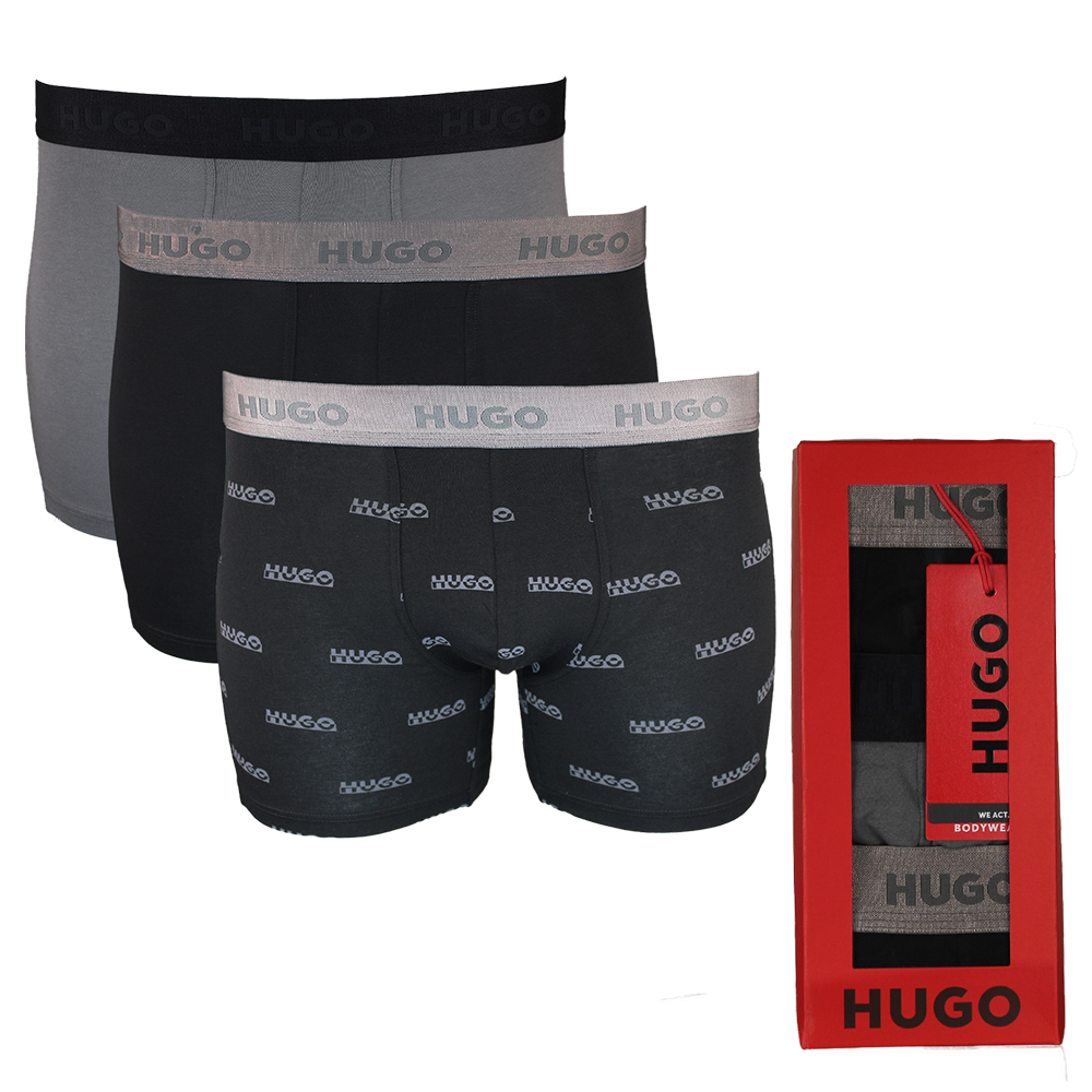 Three pairs of Hugo boxer briefs in black and gray with a red box on a white background.