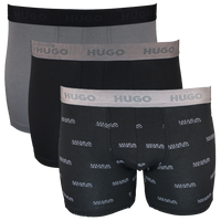 Three pairs of Hugo boxer briefs in black and gray on a white background