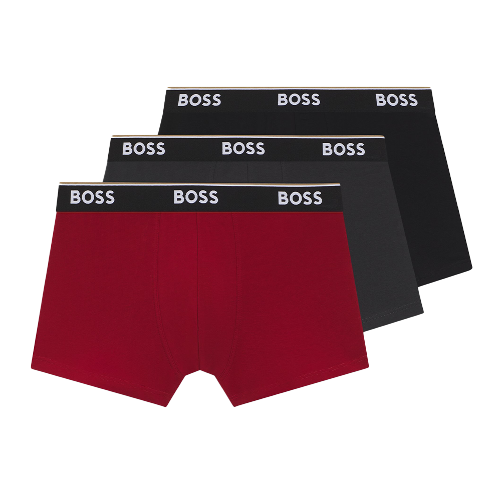 Three pairs of BOSS boxer trunks, black , grey and one red, on a white background.