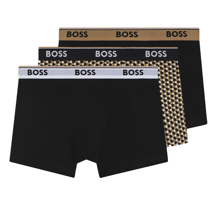 Three black boxer trunks with 'BOSS' branding on packaging against a white background