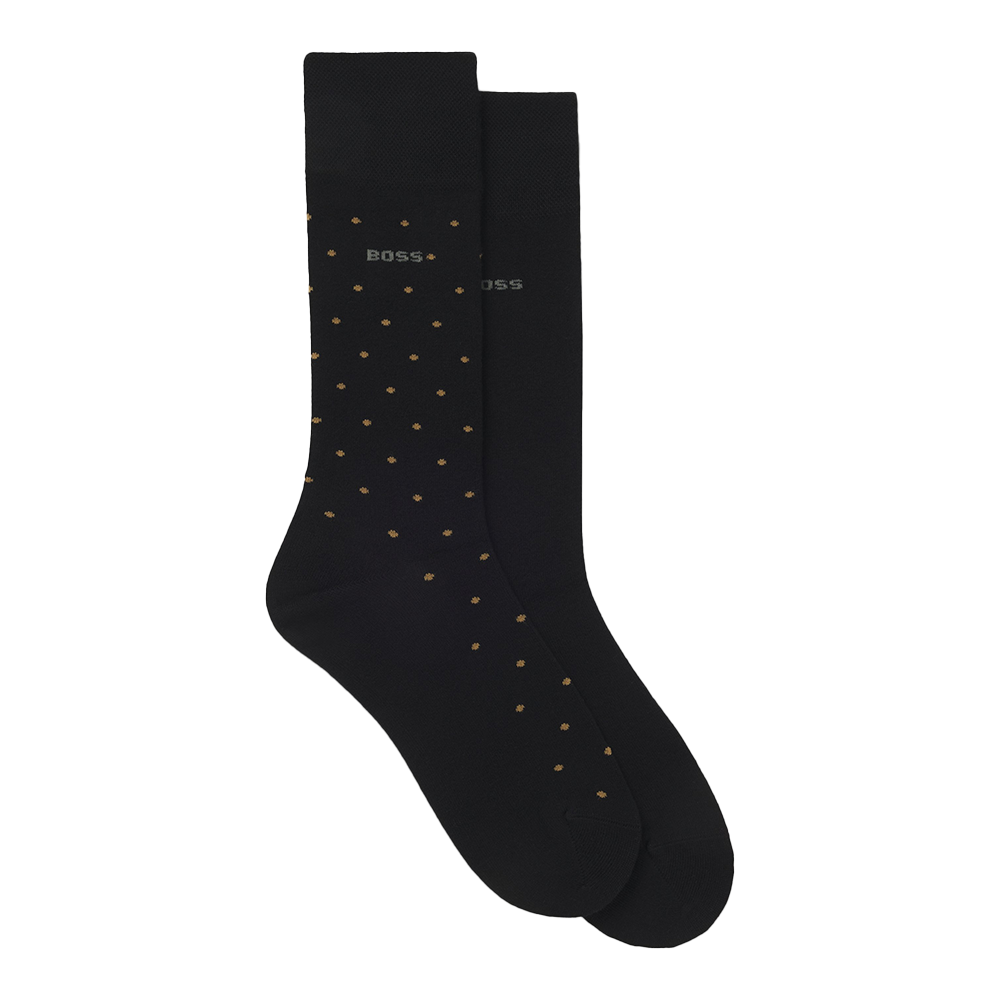 Black socks with gold polka dots on a white background