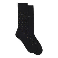 Black socks with gold polka dots on a white background
