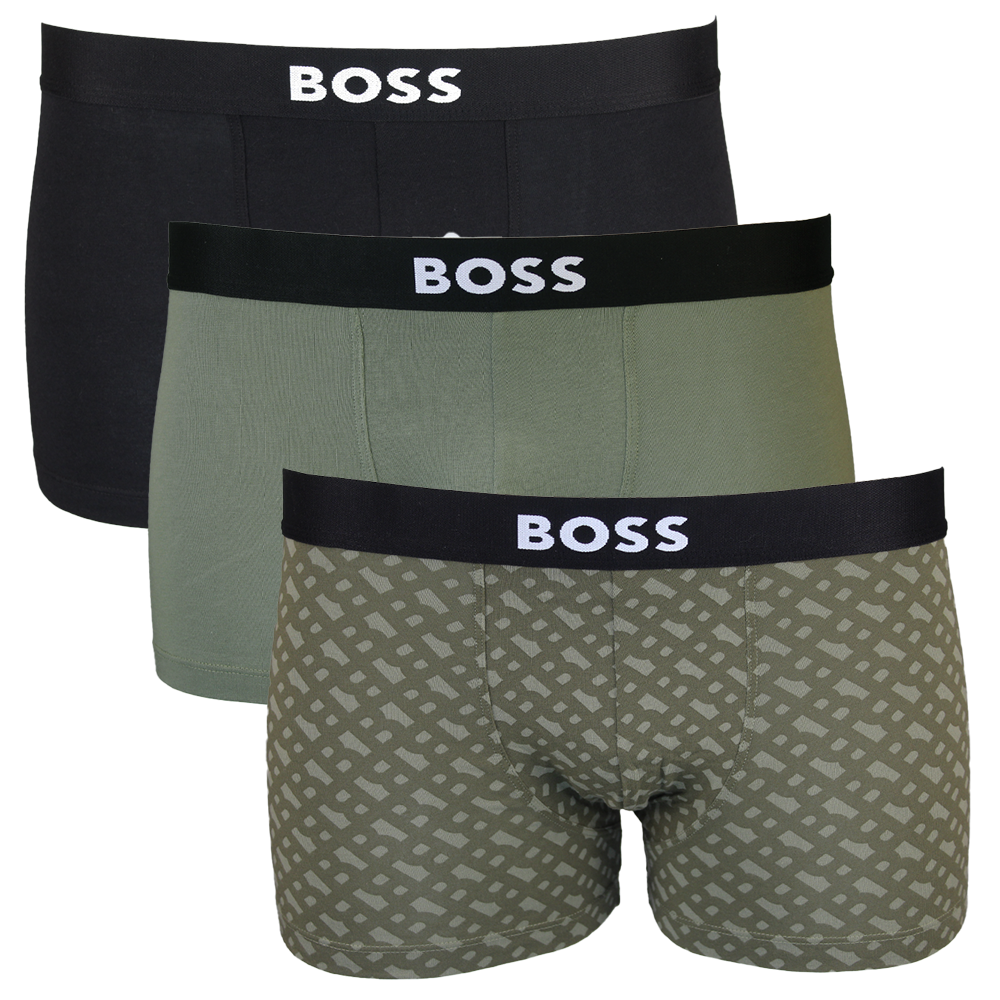 Three pairs of BOSS boxer trunks in black, green, and patterned design on a white background.
