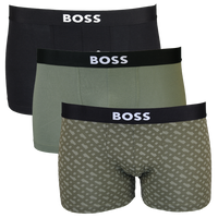 Three pairs of BOSS boxer trunks in black, green, and patterned design on a white background.