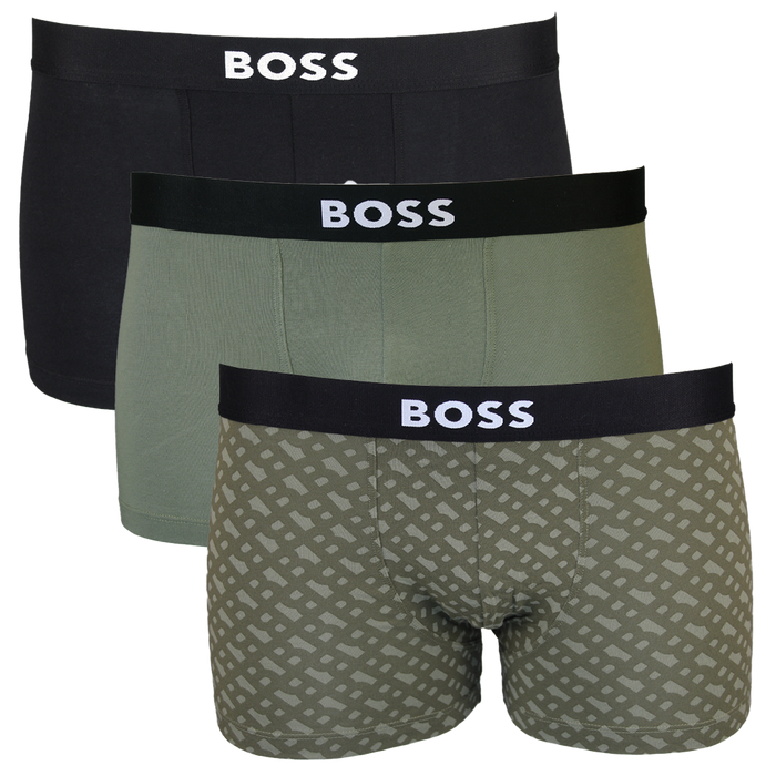 Three pairs of BOSS boxer trunks in black, green, and patterned design on a white background.