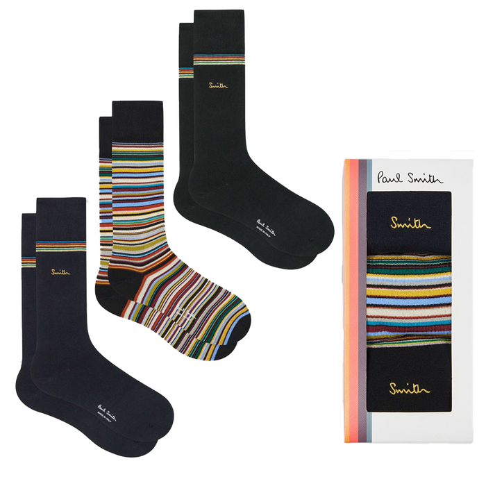 Set of black and multicolored striped socks with packaging on a white background