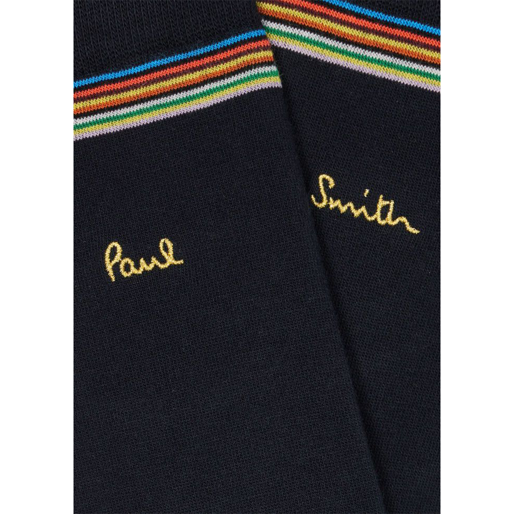 Black socks with rainbow stripes and embroidered names on a white background