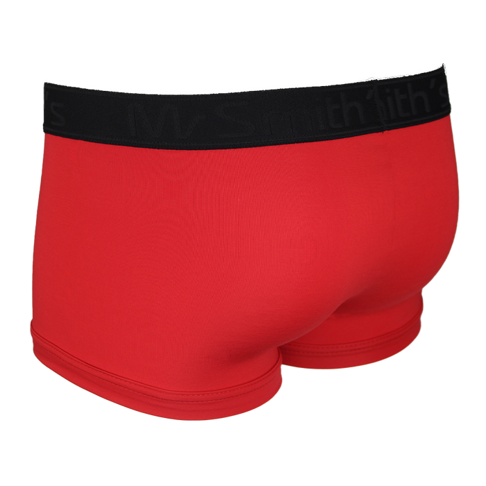 back view of red boxer trunks with a black waistband on a white background