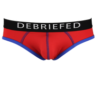 Red underwear with black waistband displaying 'DEBRIEFED' on a white background