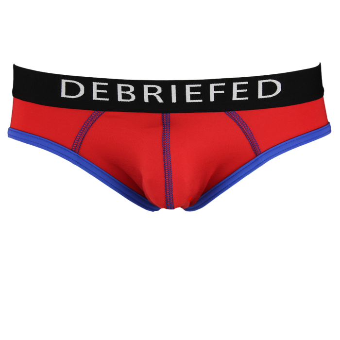 Red underwear with black waistband displaying 'DEBRIEFED' on a white background