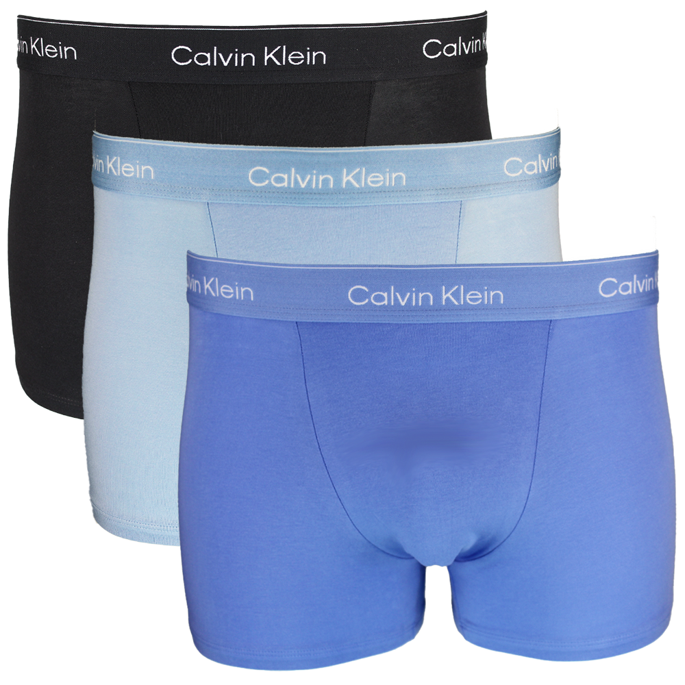 Three pairs of Calvin Klein boxer briefs in black, light blue, and dark blue on a white background.