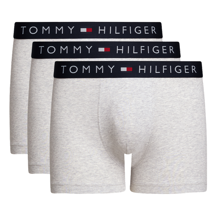Three pairs of Tommy Hilfiger gray boxer briefs with black waistbands on a white background.