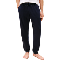 Navy blue sweatpants worn by a person on a white background