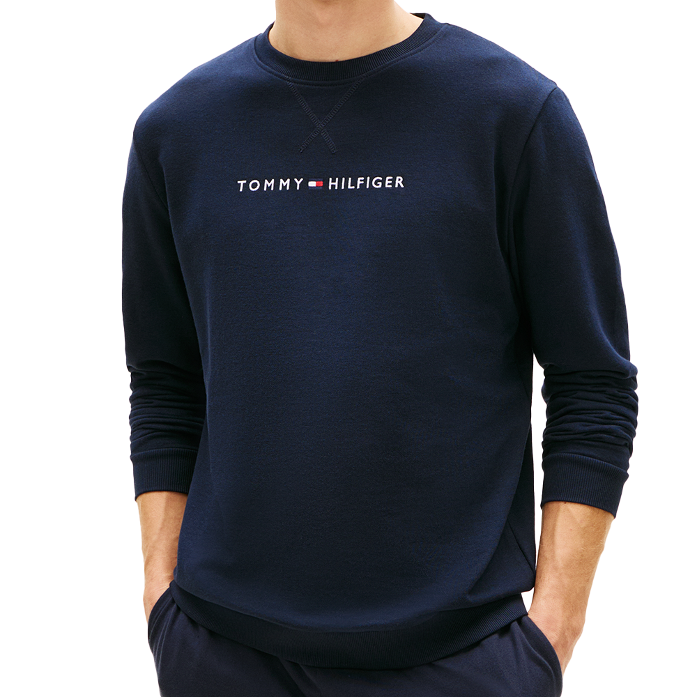 Man wearing a tommy hilfiger sweatshirt