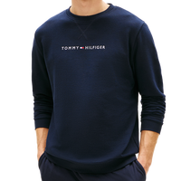 Man wearing a tommy hilfiger sweatshirt