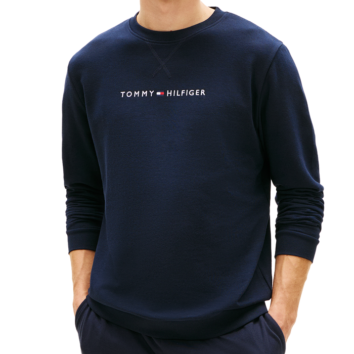 Man wearing a tommy hilfiger sweatshirt