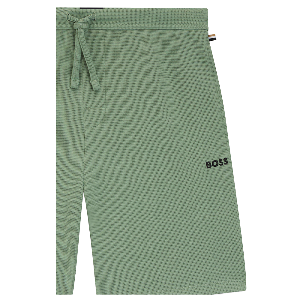 Green shorts with boss branding