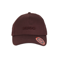 Brown cap with 'HUGO' branding on a white background