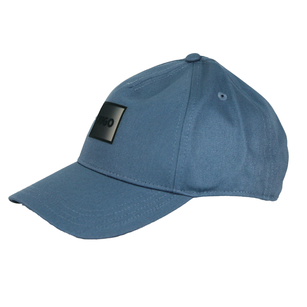 Blue baseball cap with a black patch on a white background