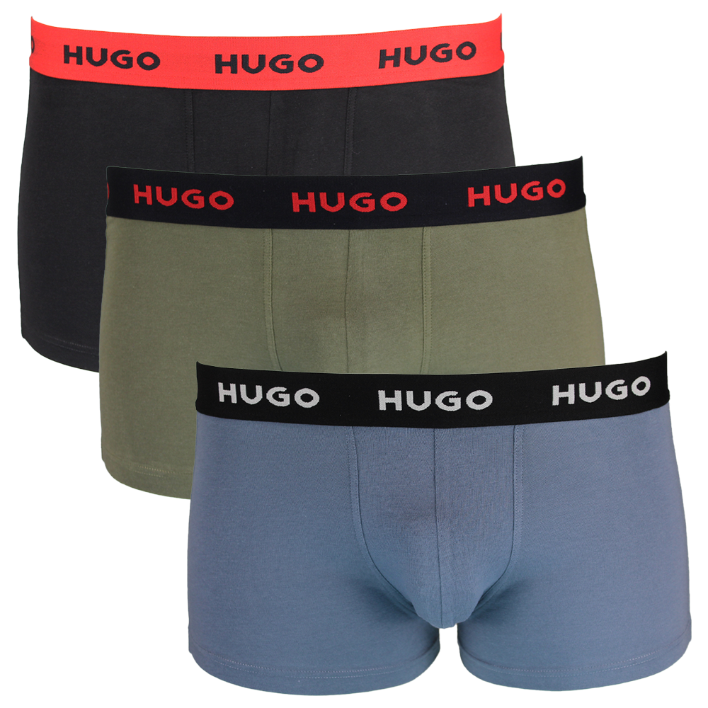 Three boxer trunks black, green, and blue  with repeated HUGO branding on the waistband.